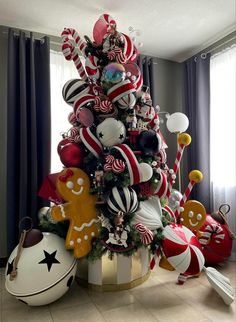 a christmas tree decorated with candy canes and candies