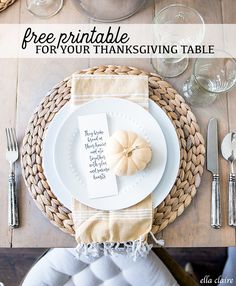 a place setting with white plates, silverware and napkins on a wooden table