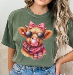 a woman wearing a t - shirt with a bear on it