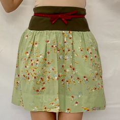 A Lovely Summer Skirt From Italian Brand Caractre C24. Cotton Lovely Colorful Small Flowers On A Most Beautiful Shade Of Green. Feels Soft And Very Comfy. Casual W: 14" L: 19.5" Plain Weave Floral Design Elasticized Waist Logo Plate 2 Side Pockets With Zippers! Military Green Elasticized Waist. Made In Italy. Size: 42/M/6 Fun Light And Colorful Skirt To Have In Your Closet For Summer Days! Caractre C24 Mini Skirt~ Green Floral ~ Light Coton ~ Italy ~Sz. 42/M~ Summer E 2232 6 Oz Spring Mini Skirt With Waistband, Spring Green Skirt With Elastic Waistband, Green Flowy Cotton Skirt, Green Skirt With Elastic Waistband For Spring, Spring Skirt With Waistband, Spring Relaxed Skirt With Waistband, Summer Mini Skirt With Waistband, Casual Skirt With Waistband For Spring, Spring Green Cotton Skirt