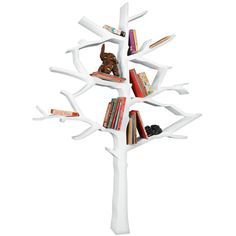 a white tree shelf with books on it and an elephant figurine in the middle