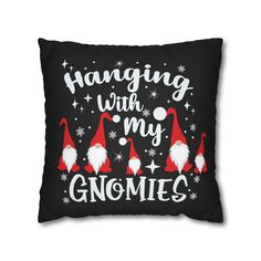 a black pillow with red and white gnomes on it that says hanging with my gnomeies