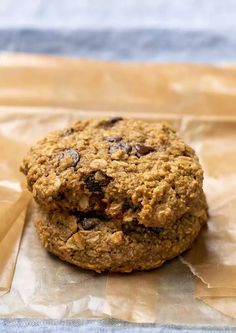 an oatmeal cookie sitting on top of a piece of wax paper