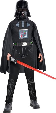 a young boy dressed in darth vader costume and holding a red light saber