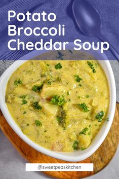 potato broccoli cheddar soup in a white bowl on a wooden board