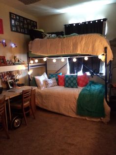 a bedroom with a bunk bed and lights on the ceiling above it is lit up