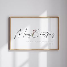 a merry christmas sign hanging on the wall