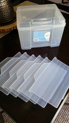 several plastic storage containers sitting on top of a table