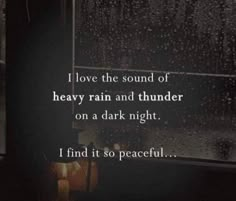 a rainy window with the words i love the sound of heavy rain and thunder on a dark night