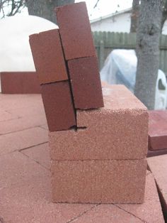 some bricks are stacked on top of each other