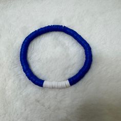 Beautiful handmade bracelet featuring navy blue and white Heishi clay beads on a stretchy band. Size of bracelet in photo: 7 1/2 inches Heishi Bracelets, Clay Bead Bracelet, Resin Bracelet, Clay Bead, Stretchy Bracelets, Clay Beads, Bead Bracelet, Handmade Bracelets, Jewelry Bracelets