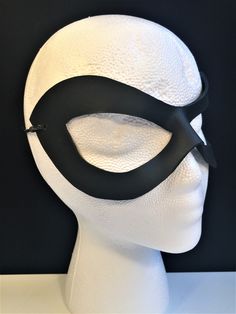 DESCRIPTIONAdd spice to your love life! This small, very lightweight, black leather mask is perfect for the beginner dominatrix or Lord of the Bedroom. Any color. Silver studs available. Waterproofed leather, glossy or matte finish, & several choices to affix the mask (cord, elastic, ribbon, waterproof cord, stick, or no holes for adhesive). Measurements: 3" high x 7" wide (tallest & widest points); 1" high between the eyes; 2.75" wide x 2.75" tall eye openings -------------------------- Lone Ranger Costume, Splatoon Costume, Mask Cord, Robin Superhero, Comicon Costume, Ranger Costume, Robin Cosplay, Black Wear, Superhero Masks