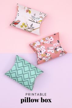 three pillows sitting next to each other on top of a pink and blue background with the words printable pillow box