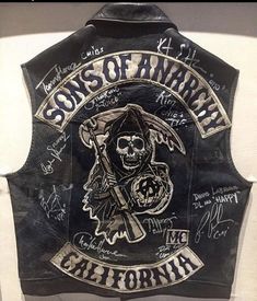 the sons of anarchy leather vest with autographs on it