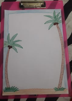 a clipboard with palm trees drawn on it in front of a zebra print background