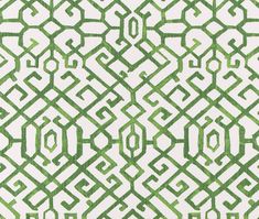 a green and white pattern on fabric