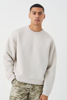 Created for comfort. Sweatshirts are built for days where you need a casual look to bang. Easily one of the best daily wear items you can get, sweatshirts always have you covered. Whether you’re pairing with jeans and wearing underneath an overshirt or you’ve gone for a more laid-back vibe and paired your sweatshirt with a tracksuit and trainers. Whatever flex you’re on, you can’t go wrong with adding a sweatshirt to your daily rotations.Style: Plain SweatshirtDesign: PlainFabric: ScubaDetail: Fabric InterestLength: CroppedNeckline: Extended NeckFit: Oversized BoxySleeve Length: Long Sleeve Urban Oversized Sweatshirt With Ribbed Cuffs, Oversized Fleece Sweatshirt Basic Style, Urban Sweatshirt With Drop Shoulder For Loungewear, Oversized Fleece Sweatshirt With Drop Shoulder, Urban Drop Shoulder Sweatshirt For Loungewear, Oversized Urban Sweater, Oversized Fleece Sweatshirt For Streetwear, Oversized Crew Neck Urban Hoodie, Trendy Crew Hoodie With Ribbed Cuffs