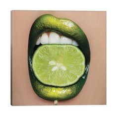 a woman's mouth with a lime slice in the shape of a kiss on it