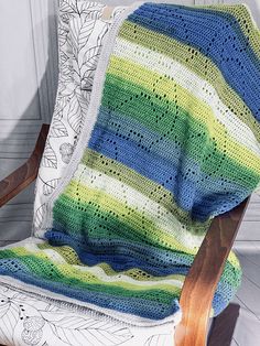 the afghan size crochet pattern is shown in green, blue and yellow stripes