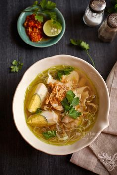 a white bowl filled with soup and vegetables