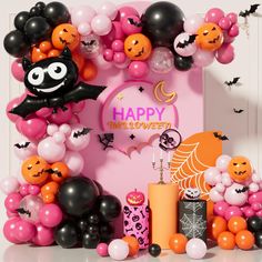 a halloween themed birthday party with balloons and decorations