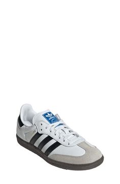 From the soccer field to the streets, this kid-size sneaker maintains its legacy with premium materials and iconic 3-Stripes at the sides. Lace-up style Removable insole Leather upper/synthetic lining/rubber sole Imported Casual Sneakers With Side Stripes For Streetwear, Low-top Streetwear Sneakers With Side Stripes, Unisex Shoes Sneakers, Ugg Classic Short, Vegan Sneakers, Native Shoes, Adidas Kids, Knit Sneakers, White Core