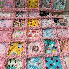 a baby blanket with many different designs on it