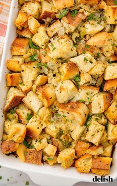 a casserole dish filled with bread and herbs