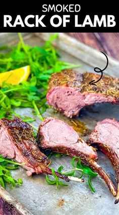 sliced rack of lamb on a cutting board with herbs and lemon wedges in the background