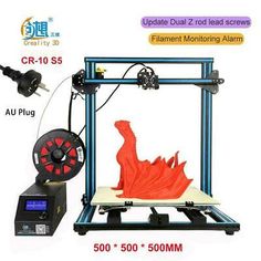 an image of a 3d printer that is being used to make a red dragon figure