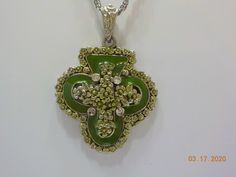 "Vintage green enamel & rhinestone shamrock pendant necklace. 16\" chain with spring ring fastener. Pendant including bale is 2 1/4\" x 1 1/2\". Green enamel, silver tone flowers, and clear rhinestones adorn this sweet pendant. Excellent condition." Green Enamel Necklace With Large Pendant, Green Rhinestone Necklace For Gift, Green Necklaces With Rhinestones As Gift, Giraffe Ring, Funky Necklace, Blue Beaded Necklace, Green Enamel, Glass Bead Necklace, Vintage Crystal