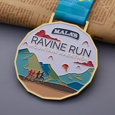 a marathon medal sitting on top of a book