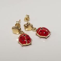 "Thanks for shopping our vintage estate store. We tend to sell well below wholesale and truly hope you enjoy all of our items. Many of the items are one of a kind, so please enjoy scrolling through the pictures and hopefully something will catch your eye. Brown spots are from camera or reflections. Nice estate 14k yellow gold red black enamel ladybug beetle star dangle earrings. Length: 5/8\" Width: 1/4\" Weight: 1.01 grams Beautiful earrings, marked 14k and backs are included." Red Enamel Clip-on Jewelry, 14k Gold Red Earrings For Pierced Ears, Nickel-free Yellow Gold Enamel Earrings, Classic Red Enamel Jewelry, Red Enamel Collectible Jewelry, Red Enamel Earrings For Anniversary, Ladybug Beetle, Ladybug Earrings, Star Dangle Earrings