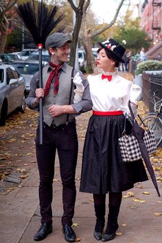 a man and woman dressed in costume standing next to each other