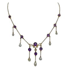 THIS IS A STUNNING VICTORIAN - ART NOUVEAU - BELLE EPOQUE NECKLACE WITH THE MOST GORGEOUS NATURAL ROUND FACETED SIBERIAN AMETHYST GEMS SET IN A WONDERFUL PENDANT DROP DESIGN WITH NATURAL PEARLS IN 14 KARAT GOLD. This antique pendant necklace is such a lovely and romantic jewel. The necklace hangs beautifully around the neck. This necklace has such fabulous movement with the dangling natural pearls hanging from the stations of round faceted purple amethysts. The color of the Amethysts is a vivid Siberian Amethyst, Victorian Pendant Necklace, Art Deco Pendant Necklace, Vintage Assemblage Jewelry, Natural Pearl Necklace, Art Nouveau Pendant, Victorian Pendants, Art Deco Pendant, Necklace Antique