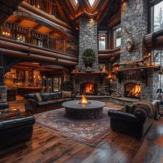 a large living room filled with furniture and a fire place in the middle of it