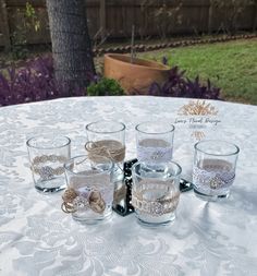 the glasses are lined up on the table