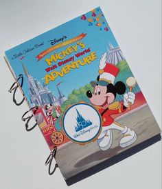 the mickey mouse's magic kingdom adventure book is opened to show it's cover