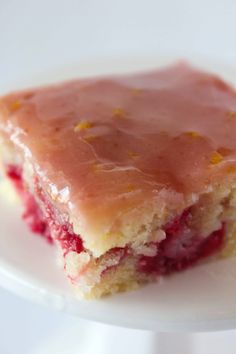 raspberry lemonade bars on a plate with text overlay that reads, raspberry lemonade bars refreshing, simple & delicious