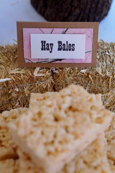 a close up of food on a plate with a sign that says hay bakes