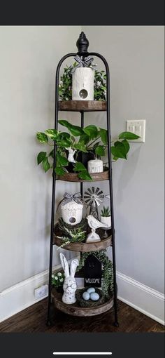 the corner shelf is filled with potted plants and other things to decorate on it