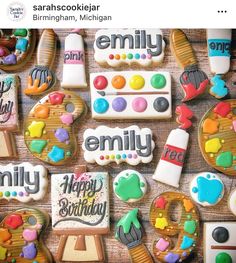 decorated cookies with the words happy birthday are arranged on a wooden table next to each other