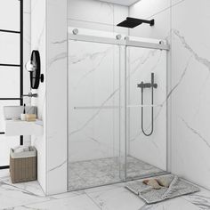 a walk in shower sitting next to a white tiled wall and floor with black accents