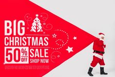 a man dressed as santa claus holding up a big christmas sale banner with the words 50 % off