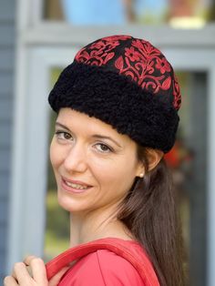 Custom-designed suede black base and red embroidered hat. Multiple colors to choose from. Stylish suede embroidered hats with lamb wool trimming.   We believe fashion should be authentic, affordable, and kind to planet Earth. That's why our accessories are handmade from natural or recycled fabrics by the most  talented artisans of Kashmir - the "UNESCO designated city of crafts". These eco-friendly hats are sustainably made from offcut suede, which would have ended in a landfill. Fabric: Suede w Cheap Red Embroidered Hats, Red Bohemian Embroidered Hat, Red Embroidered Cap, Red Brimmed Winter Hat, Whimsical Red Winter Hat, Wool Hats, Trapper Hats, Embroidered Hat, Embroidered Gifts