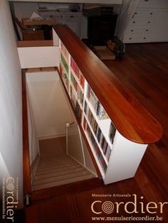 there is a book shelf with pictures on it