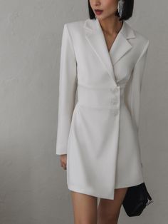 This sleek mini blazer dress is tailored from sturdy suit fabric in a single-breasted silhouette. Structured with powerful shoulders and generous lapels it falls to a flared hem and has an asymmetric chunky button front.- mini-length hem- slightly close fit- single-breasted silhouette- long sleeves- A-line hem- button fastening Formal Wrap Dress, Blazer Dress Outfits, Mini Blazer, Wrap Mini Dress, Classic Style Women, Online Fashion Store, Swimwear Shorts, Suit Fabric, Denim Jackets