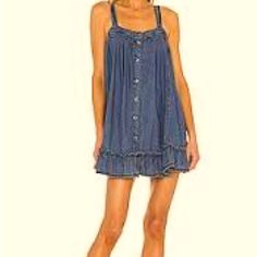 Free People Denim Dress. Buttons Down The Front With Adjustable Straps. Blue Mini Denim Dress For Beach, Denim Sundress For Summer, Denim Sundress Mini Dress For Summer, Blue Denim Mini Dress With Frayed Hem, Casual Denim Dress For Dress Down Summer Days, Beach Sundress In Denim, Denim Blue Mini Denim Dress For Summer, Denim Blue Cotton Mini Dress For The Beach, Denim Blue Mini Dress With Frayed Hem For Spring