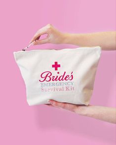 a person holding a white bag with the words bride's emergency survival kit on it