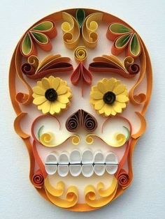 a paper skull with flowers on it's face